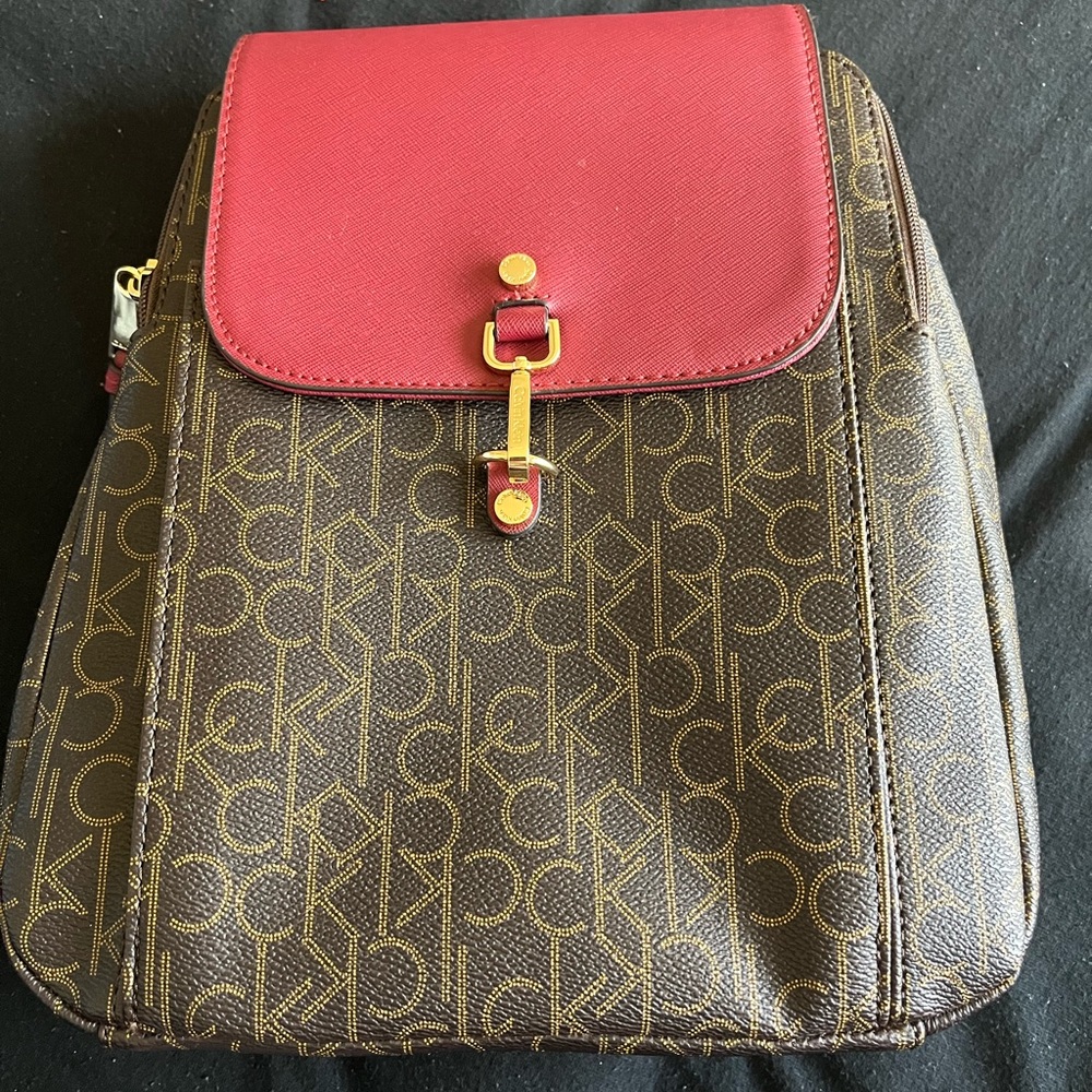 Calvin Klein back pack purse in signature CK print-Like New!